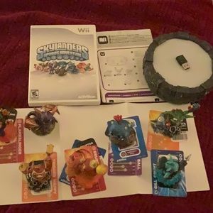 Skylander starter game, pad, and 7 characters.